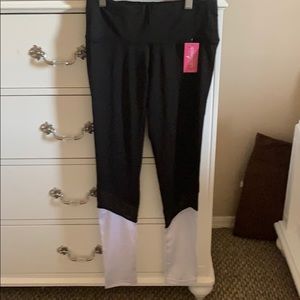 Black athletic leggings with white at bottom